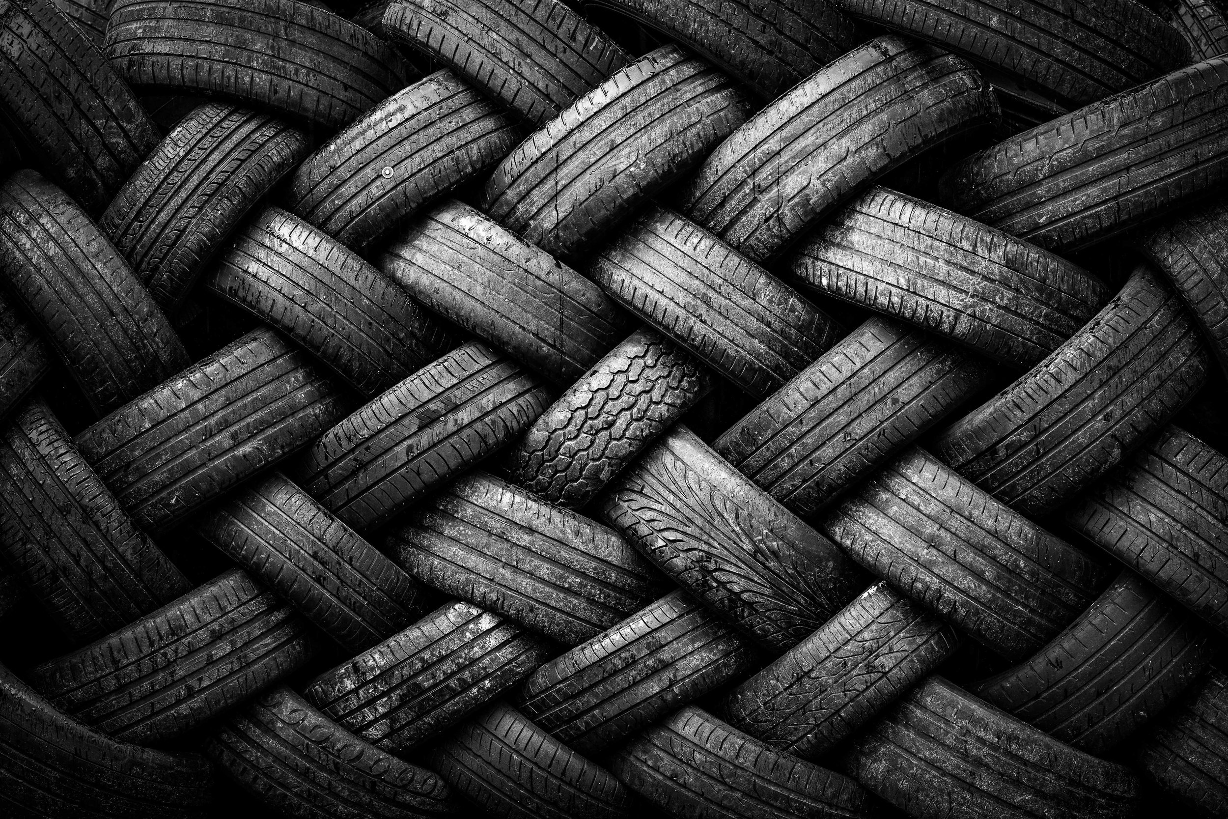 A repeating pattern of stacked tyres