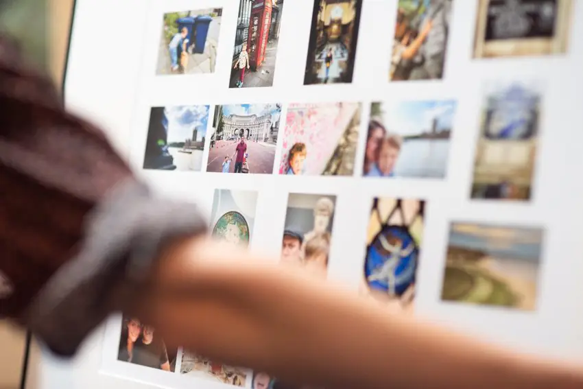 A framed collage print displayed in a home